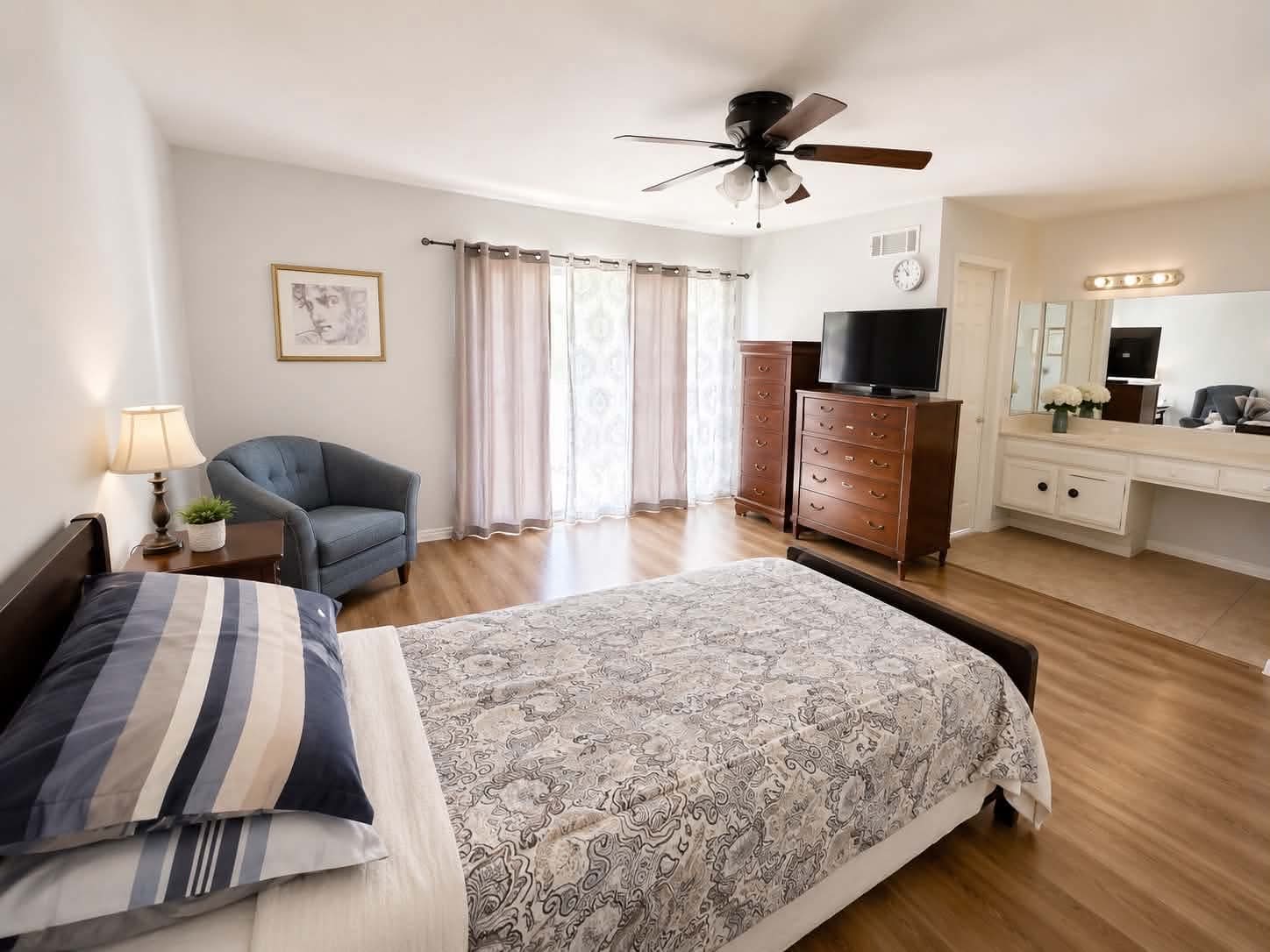 A spacious private bedroom at Tessa Place 2 with its own vanity area.
