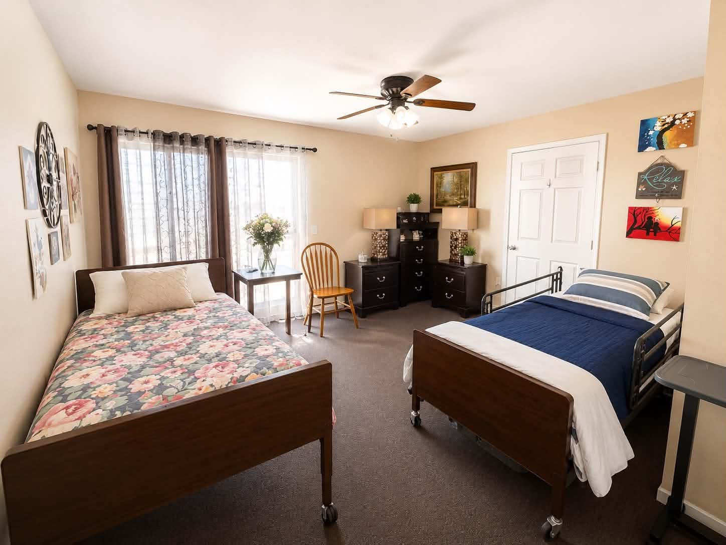 A shared two-bed room at Tessa Place 2 with bright window and bedside tables.